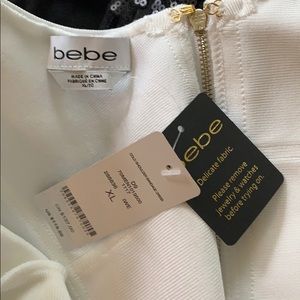 NWT. BEBE size xl white body con dress
